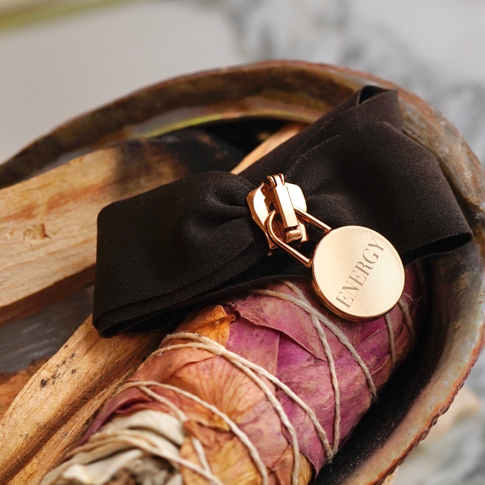 Engraved energy bracelet with rose gold charm and black bow handcrafted in Italy for mindfulness and energy alignment