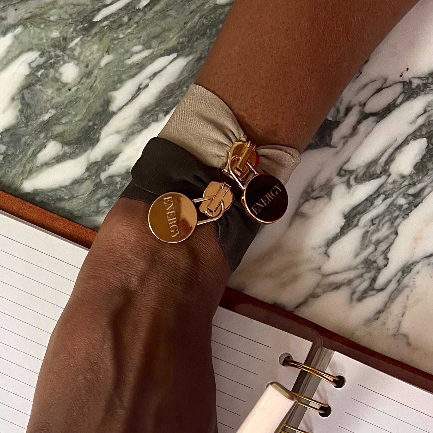 Engraved energy bracelet with gold charms on satin fabric wristbands