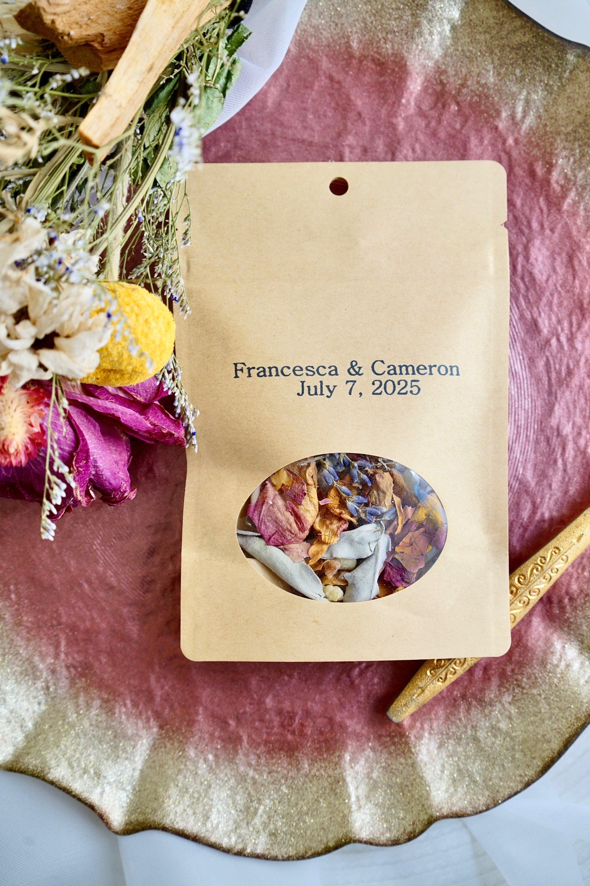 New Beginnings Herbal Incense blend with frankincense, rose, and lavender in kraft packaging on decorative tray