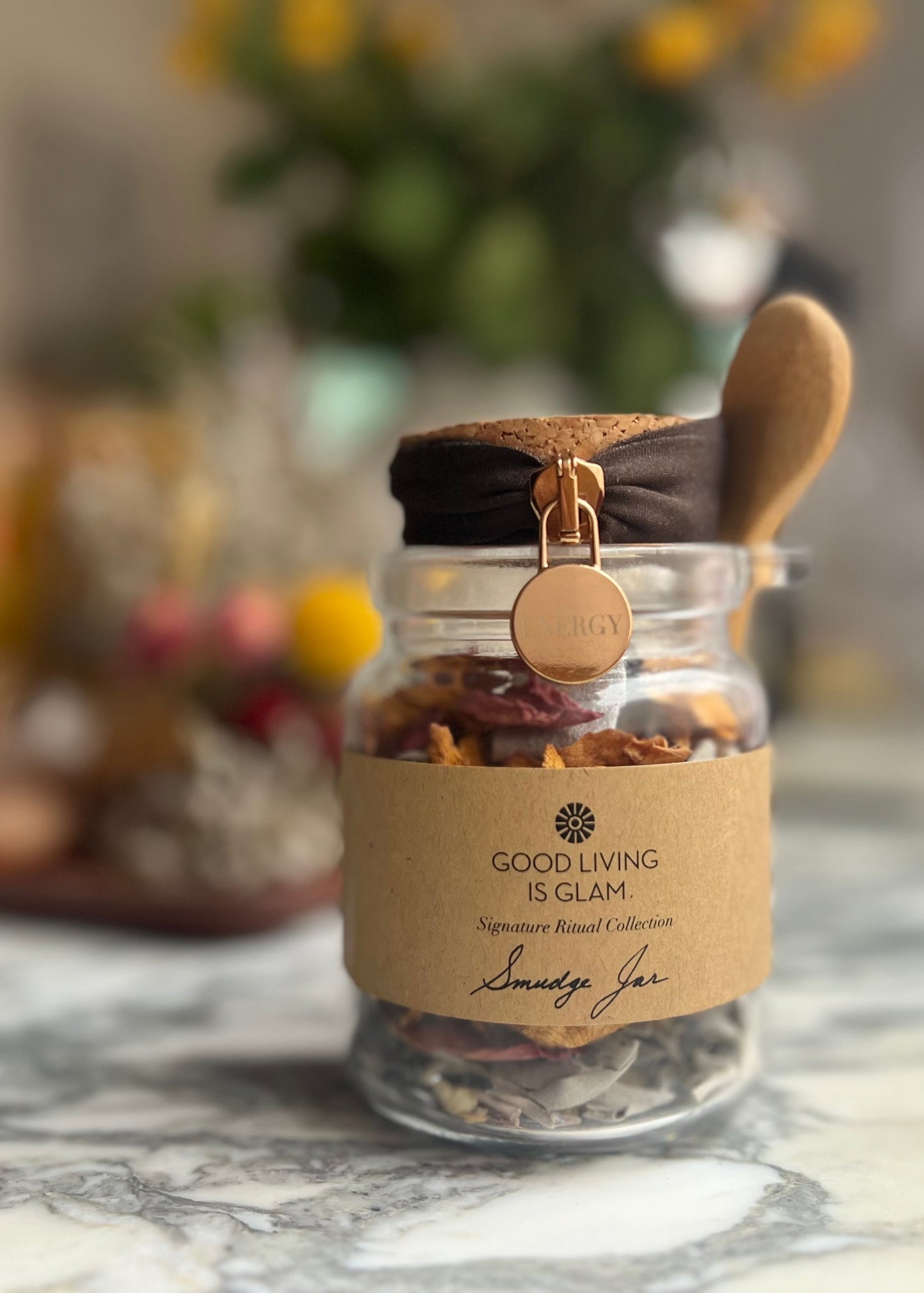 Nourish Your Energy Duo Floral Sage Smudge Jar for spiritual cleansing with a wooden spoon on marble surface