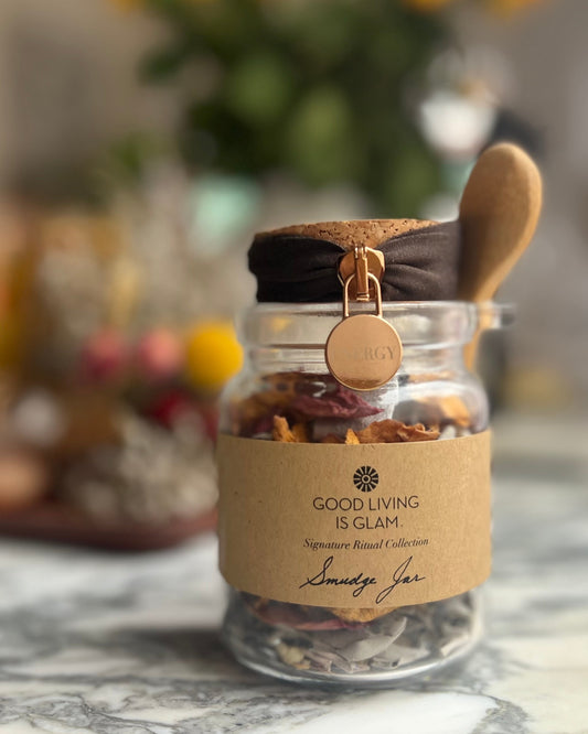 Nourish Your Energy Duo Floral Sage Smudge Jar for spiritual cleansing with a wooden spoon on marble surface