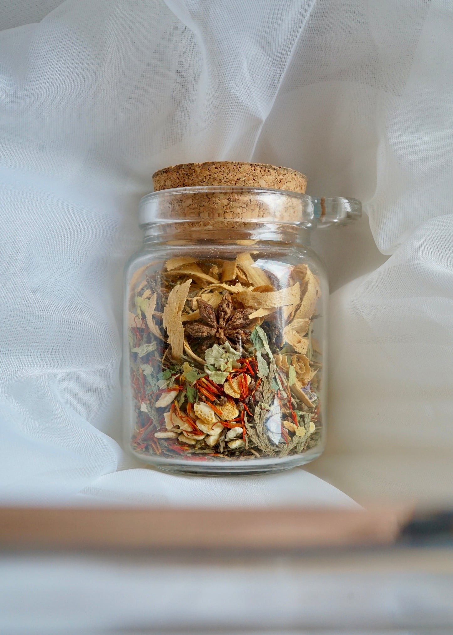 EverKindle Kindle & Simmer Autumn Incense in a corked glass jar with dried herbs and flowers
