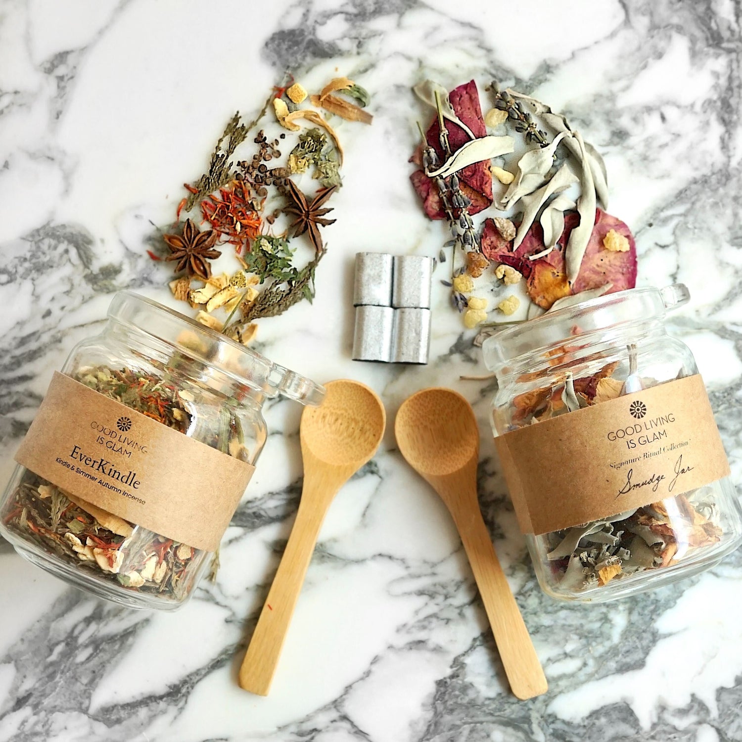 EverNourish Alchemy Set jars with dried herbs and wooden spoons on marble surface
