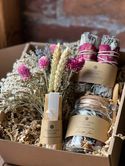 incense bundles gift set with dried flowers, palo santo sticks, and aromatic smudge jars in a gift box