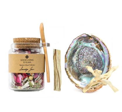 Jar of dried herbs with cork lid, wooden sticks, and a decorative shell on a white background